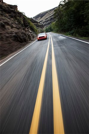 simsearch:6118-09027936,k - A blurred road and a car traveling along a highway in eastern Washington State, USA. Stockbilder - Premium RF Lizenzfrei, Bildnummer: 6118-09173621
