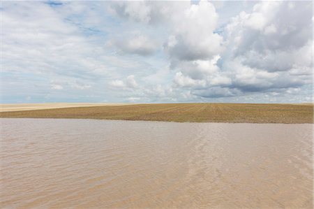 Flooded farmland and overcast sky Stock Photo - Premium Royalty-Free, Code: 6118-09173777