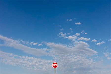 road sign, canada - Stop sign and blue sky, near Cadillac, Saskatchewan, Canada. Stock Photo - Premium Royalty-Free, Code: 6118-09173797