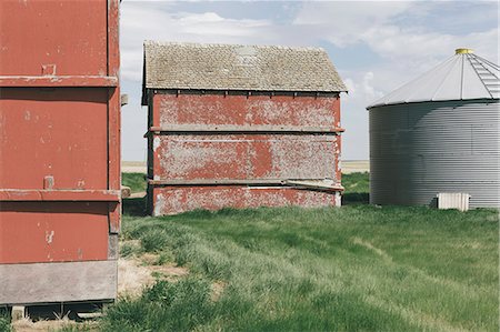 red barn in field - Old farm outbuildings on prairie, Stock Photo - Premium Royalty-Free, Code: 6118-09173844