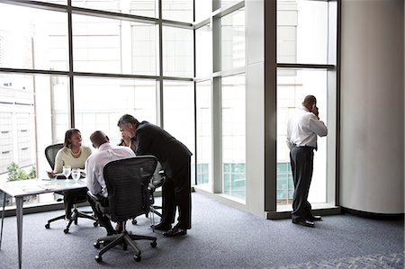 simsearch:6118-09173926,k - A middle eastern businessman on the phone during a meeting. Stock Photo - Premium Royalty-Free, Code: 6118-09174053