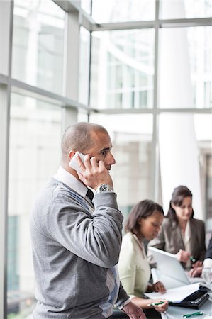 simsearch:6118-09173926,k - A middle eastern businessman on the phone during a meeting. Stock Photo - Premium Royalty-Free, Code: 6118-09174051