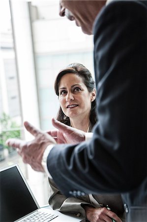 simsearch:6118-09173926,k - A Caucasian businesswoman listening to a conversation in a business meeting. Stock Photo - Premium Royalty-Free, Code: 6118-09174057