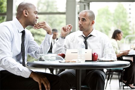 simsearch:6128-08780839,k - A black businessman and a middle eastern businessman having a business lunch. Photographie de stock - Premium Libres de Droits, Code: 6118-09174083