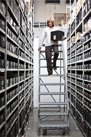 A technician pulling parts for a project in a technical research and development site. Photographie de stock - Premium Libres de Droits, Code: 6118-09174131