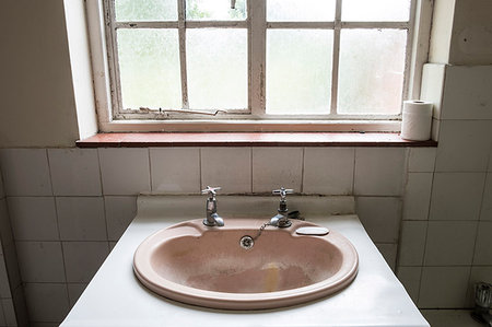 High angle close up of old and dirty oval basing in bathroom of empty building. Stock Photo - Premium Royalty-Free, Code: 6118-09183332