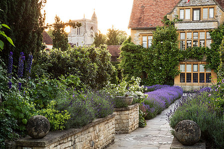flower bed - View of historic manor house from across a walled garden with path and flowerbeds. Stock Photo - Premium Royalty-Free, Code: 6118-09183442