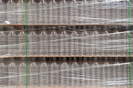 simsearch:6113-07160269,k - Closeup of pallets of bottled water in a bottling plant. Stock Photo - Premium Royalty-Free, Code: 6118-09129425