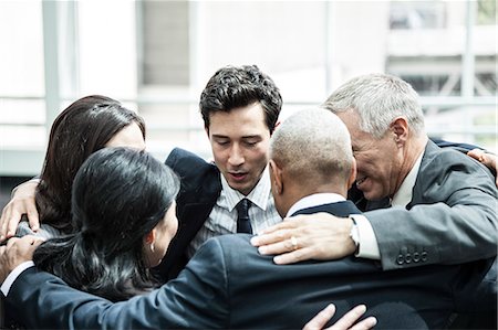 simsearch:6118-09129521,k - Mixed race group of business people in an informal team building meeting. Stock Photo - Premium Royalty-Free, Code: 6118-09129567