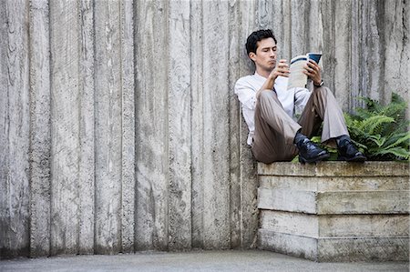 Businessman taking a break in a city park alcove. Stock Photo - Premium Royalty-Free, Code: 6118-09129579