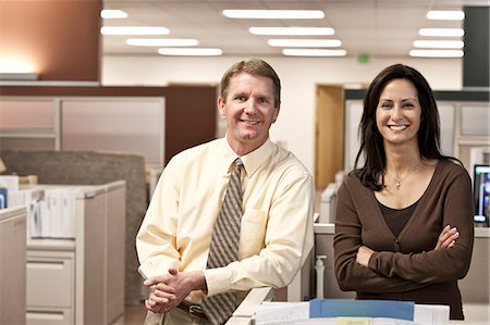 simsearch:6118-09129966,k - Caucasian man and woman executives in cubicle area of new office space Stock Photo - Premium Royalty-Free, Code: 6118-09129506