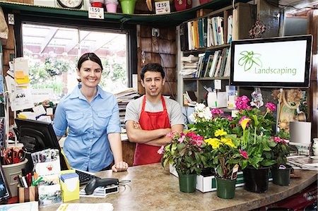 simsearch:6118-08725578,k - Caucasian man and woman employees of a garden centre nursery. Stock Photo - Premium Royalty-Free, Code: 6118-09129796