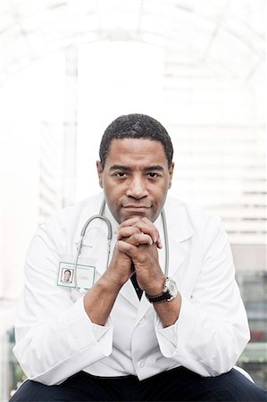 simsearch:6118-09129710,k - Black man doctor in lab coat with a stethoscope. Stockbilder - Premium RF Lizenzfrei, Bildnummer: 6118-09129700
