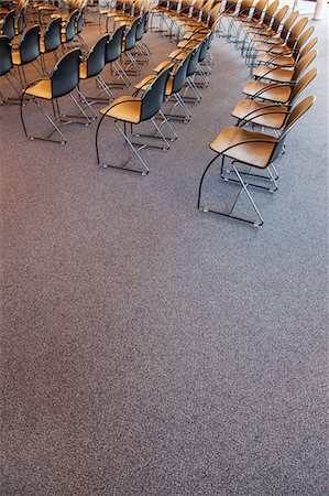 simsearch:649-07238923,k - Folding chairs lined up for a business meeting Stock Photo - Premium Royalty-Free, Code: 6118-09129956