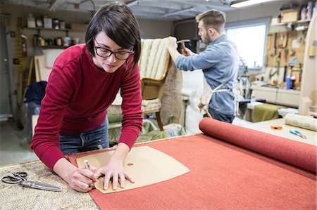 simsearch:845-06008176,k - A young Caucasian couple working on a chair as a team of upholsterers. Stock Photo - Premium Royalty-Free, Code: 6118-09130084
