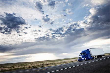 shipping containers on trucks - commercial truck driving through the high desert country of eastern Washington, USA Stock Photo - Premium Royalty-Free, Code: 6118-09139470