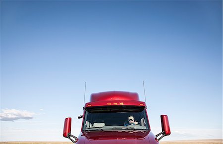 road truck - View of a Caucasian woman driver in the cab of her  commercial truck. Stock Photo - Premium Royalty-Free, Code: 6118-09139480