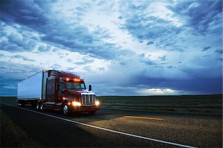 3/4 front view of a  commercial truck on the road in the early evening in eastern Washington, USA. Stock Photo - Premium Royalty-Free, Code: 6118-09139544