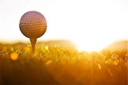 simsearch:6118-09144991,k - A golf ball on a tee and ready to be hit as the sun comes up. Stock Photo - Premium Royalty-Free, Code: 6118-09139773