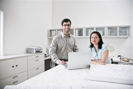 simsearch:6118-09139986,k - Hispanic man and woman working together in an architect's office. Foto de stock - Sin royalties Premium, Código: 6118-09139855