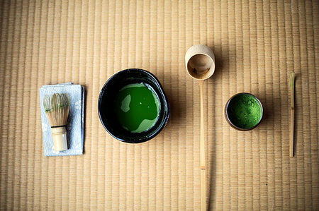 Tea ceremony utensils including bowl of green Matcha tea and bamboo whisk. Stock Photo - Premium Royalty-Free, Code: 6118-09200291