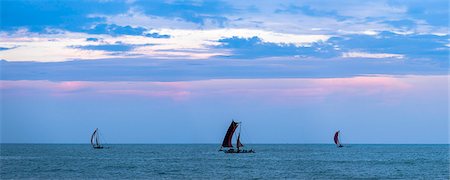 sri lanka - Negombo, traditional outrigger fishing boats (oruva) returning at sunrise to Negombo fishing market, Sri Lanka, Asia Stock Photo - Premium Royalty-Free, Code: 6119-07451177