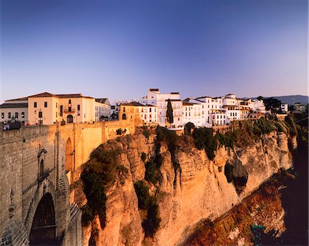 simsearch:6119-07451812,k - Houses on the Tajo edge and the bridge Puente Nuevo, old town of Ronda at sunset, Province Malaga, Andalusia, Spain, Europe Stock Photo - Premium Royalty-Free, Code: 6119-07451885