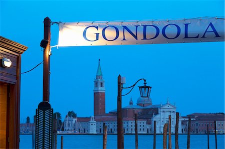 Gondola station near St. Mark's Square at night, with San Giorgio Maggiore in the distance, Venice, UNESCO World Heritage Site, Veneto, Italy, Europe Stock Photo - Premium Royalty-Free, Code: 6119-07452807