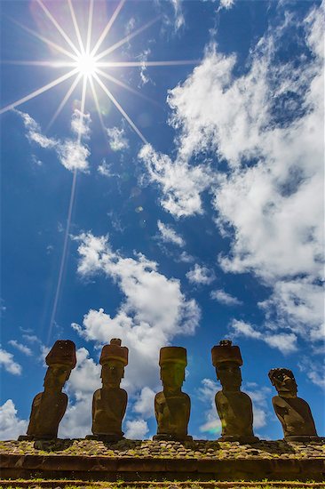 Moai with scoria red topknots at the restored ceremonial site of Ahu Nau Nau on Easter Island (Isla de Pascua) (Rapa Nui), UNESCO World Heritage Site, Chile, South America Stock Photo - Premium Royalty-Free, Image code: 6119-07587364