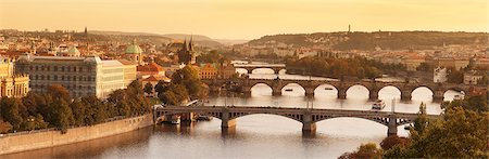 panoramic cityscapes - Bridges over the Vltava River including Charles Bridge, UNESCO World Heritage Site, and the Old Town Bridge Tower at sunset, Prague, Bohemia, Czech Republic, Europe Stock Photo - Premium Royalty-Free, Code: 6119-07587403