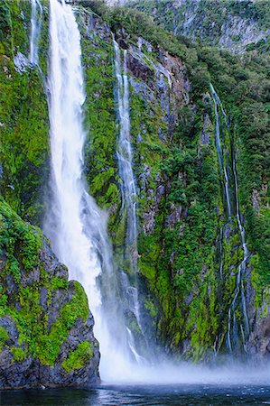 fjordland national park - Huge waterfall in Milford Sound, Fiordland National Park, UNESCO World Heritage Site, South Island, New Zealand, Pacific Stock Photo - Premium Royalty-Free, Code: 6119-07652081