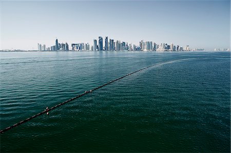 skyline water - Downtown Doha with its impressive skyline of skyscrapers, Doha, Qatar, Middle East Foto de stock - Sin royalties Premium, Código: 6119-07652109