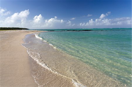 Idyllic beach scene with blue sky, aquamarine sea and soft sand, Ile Aux Cerfs, Mauritius, Indian Ocean, Africa Stock Photo - Premium Royalty-Free, Code: 6119-07744587