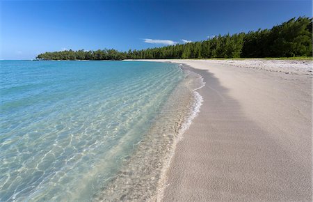 Idyllic beach scene with blue sky, aquamarine sea and soft sand, Ile Aux Cerfs, Mauritius, Indian Ocean, Africa Stock Photo - Premium Royalty-Free, Code: 6119-07744586