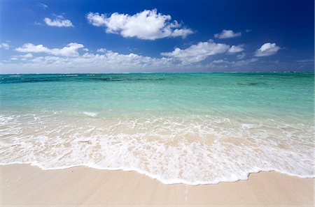 Idyllic beach scene with blue sky, aquamarine sea and soft sand, Ile Aux Cerfs, Mauritius, Indian Ocean, Africa Stock Photo - Premium Royalty-Free, Code: 6119-07744590