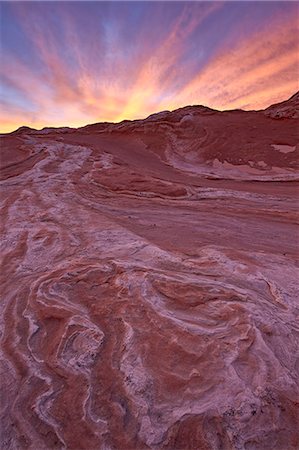 Brilliant orange clouds at sunset over red and white sandstone, White Pocket, Vermilion Cliffs National Monument, Arizona, United States of America, North America Stock Photo - Premium Royalty-Free, Code: 6119-07781194