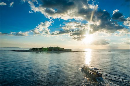 south pacific - Dramatic clouds at sunset over the Mamanucas Islands, Fiji, South Pacific, Pacific Stock Photo - Premium Royalty-Free, Code: 6119-07781252