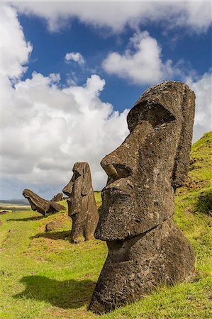 Moai sculptures in various stages of completion at Rano Raraku, the quarry site for all moai, Rapa Nui National Park, UNESCO World Heritage Site, Easter Island (Isla de Pascua), Chile, South America Stock Photo - Premium Royalty-Free, Code: 6119-07734949