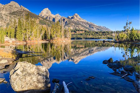 Reflections of the Teton Range in Taggart Lake, Grand Teton National Park, Wyoming, United States of America, North America Stockbilder - Premium RF Lizenzfrei, Bildnummer: 6119-07734985