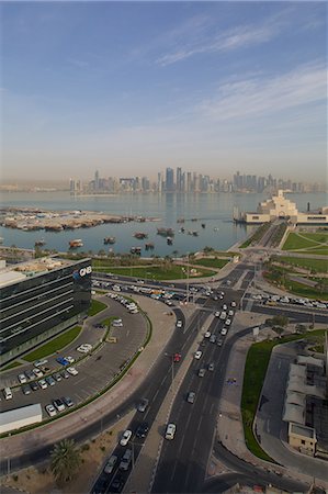 doha qatar city pictures - Museum of Islamic Art and West Bay Central Financial District from East Bay District, Doha, Qatar, Middle East Photographie de stock - Premium Libres de Droits, Code: 6119-07735103