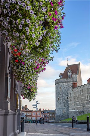 england, united kingdom - Hanging flowers in Windsor high street with Windsor Castle in the background, Windsor, Berkshire, England, United Kingdom, Europe Stock Photo - Premium Royalty-Free, Code: 6119-07845348