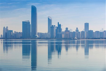 simsearch:6119-07845356,k - View of City skyline reflecting in Persian Gulf, Abu Dhabi, United Arab Emirates, Middle East Stock Photo - Premium Royalty-Free, Code: 6119-07845354