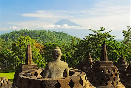 Borobodur, UNESCO World Heritage Site, with Mount Merapi in the distance, Kedu Plain, Java, Indonesia, Southeast Asia, Asia Stock Photo - Premium Royalty-Free, Code: 6119-07845593