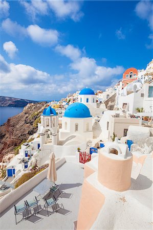 simsearch:6119-07943843,k - Greek church with three blue domes in the village of Oia, Santorini (Thira), Cyclades Islands, Greek Islands, Greece, Europe Stock Photo - Premium Royalty-Free, Code: 6119-07943844