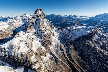 simsearch:6119-09238986,k - The massive shape of the Matterhorn sorrounded by its mountain range covered in snow, Swiss Canton of Valais, Swiss Alps, Switzerland, Europe Photographie de stock - Premium Libres de Droits, Code: 6119-08062066