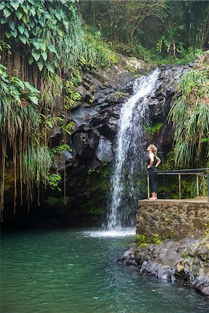 Woman looking at the Annandale Falls, Grenada, Windward Islands, West Indies, Caribbean, Central America Stock Photo - Premium Royalty-Free, Code: 6119-08062371