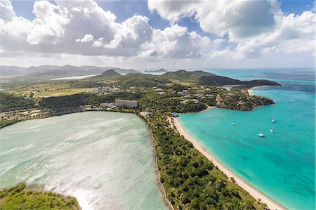 Aerial view of a lagoon on the Caribbean island of Antigua a thin line of sand divides the small salt basin from the sea, Antigua, Leeward Islands, West Indies, Caribbean, Central America Foto de stock - Sin royalties Premium, Código: 6119-08126507