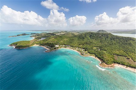 Aerial view of the rugged coast of Antigua full of bays and beaches fringed by dense tropical vegetation, Antigua, Leeward Islands, West Indies, Caribbean, Central America Photographie de stock - Premium Libres de Droits, Code: 6119-08126509