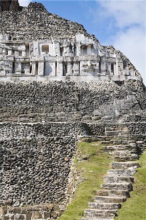 Frieze and steps up to the 130ft high El Castillo, Mayan site, Xunantunich, San Ignacio, Belize, Central America Stock Photo - Premium Royalty-Free, Code: 6119-08266368