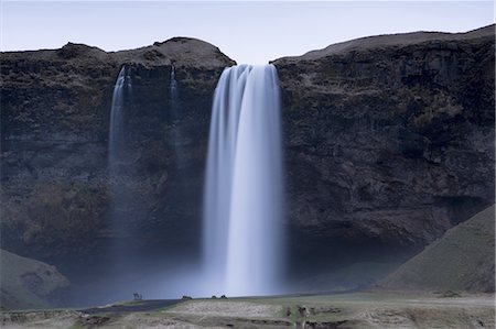simsearch:6119-07453058,k - Seljalandsfoss Waterfall captured at dusk using long exposure to record movement in the water, near Hella, southern area, Iceland, Polar Regions Foto de stock - Sin royalties Premium, Código: 6119-08266469
